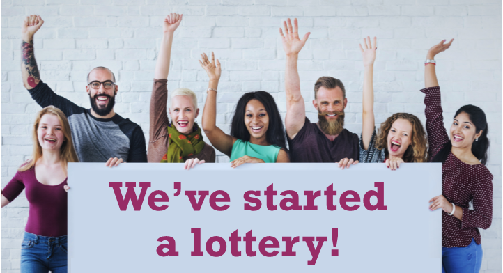 People celebrating starting their fundraising lottery